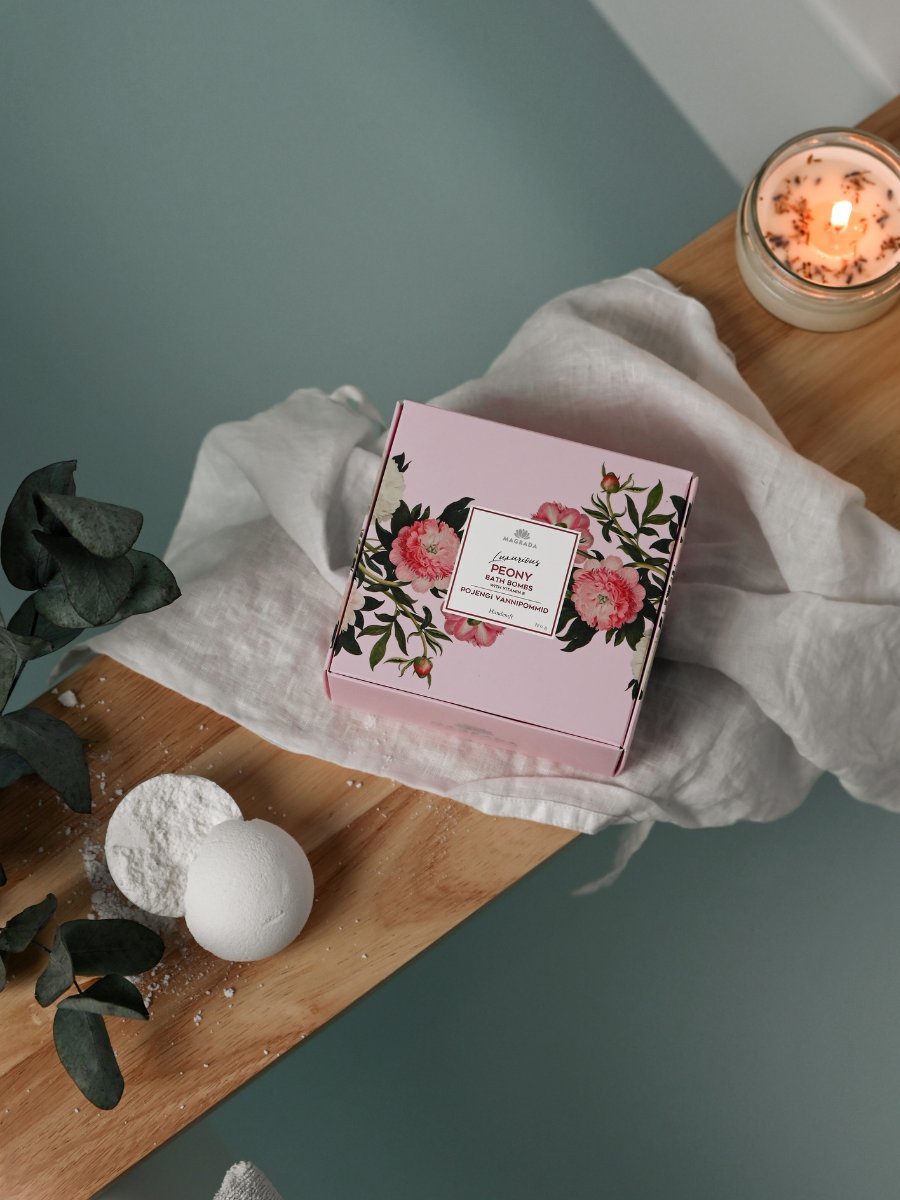 Magrada Organic Cosmetics peony bath bomb gift set with floral pink box and white bath bombs on wooden board