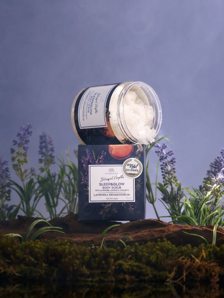 Magrada Organic Cosmetics lavender body scrub jar opened on packaging with lavender flowers background
