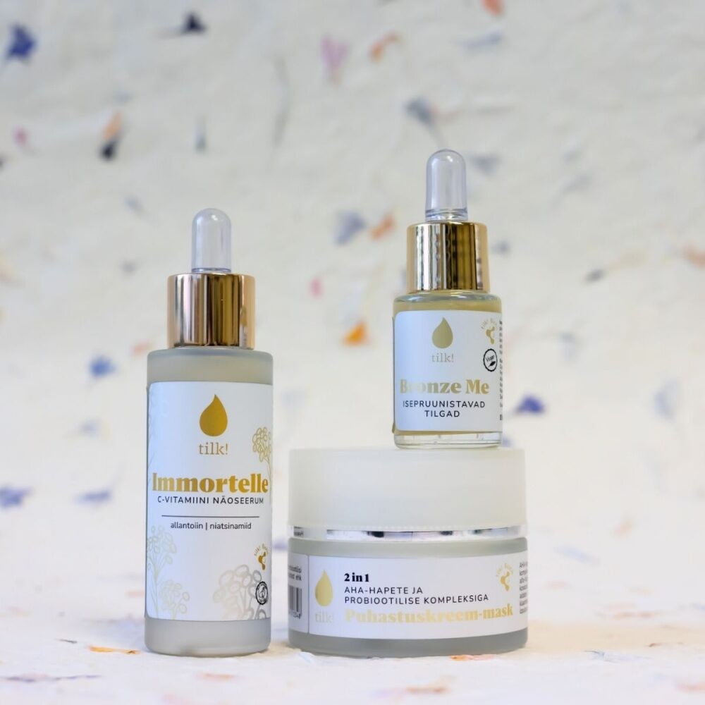 Tilk skincare set featuring Immortelle C vitamin serum, Bronze Me tanning drops, and 2 in 1 exfoliating probiotic face mask