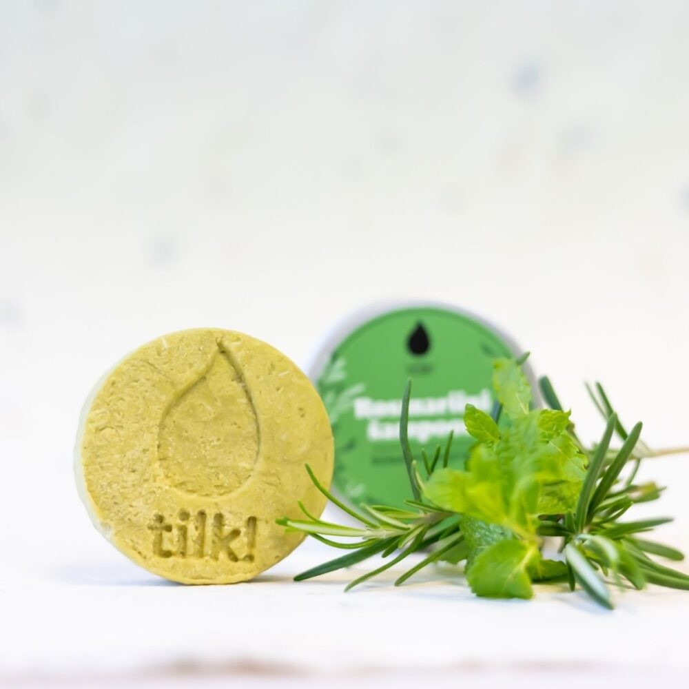 Tilk matcha shampoo bar with natural herbs and green packaging for eco-friendly hair care